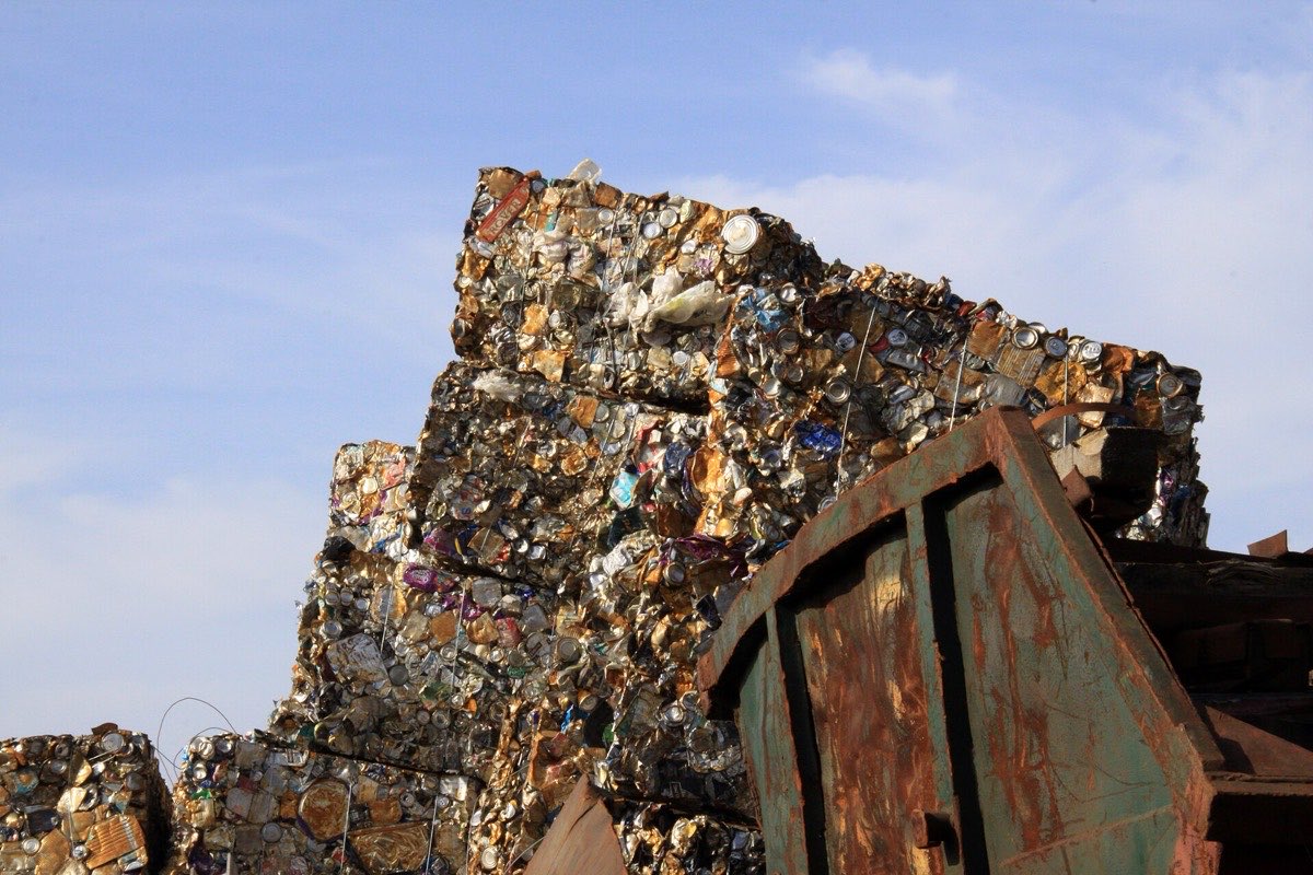 Baled mixed non-ferrous scrap metal stacked at a recycling yard