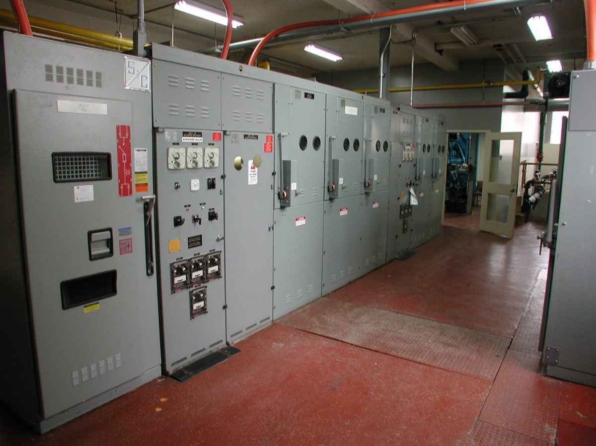 Row of industrial electrical switch gear cabinets and motor control centers