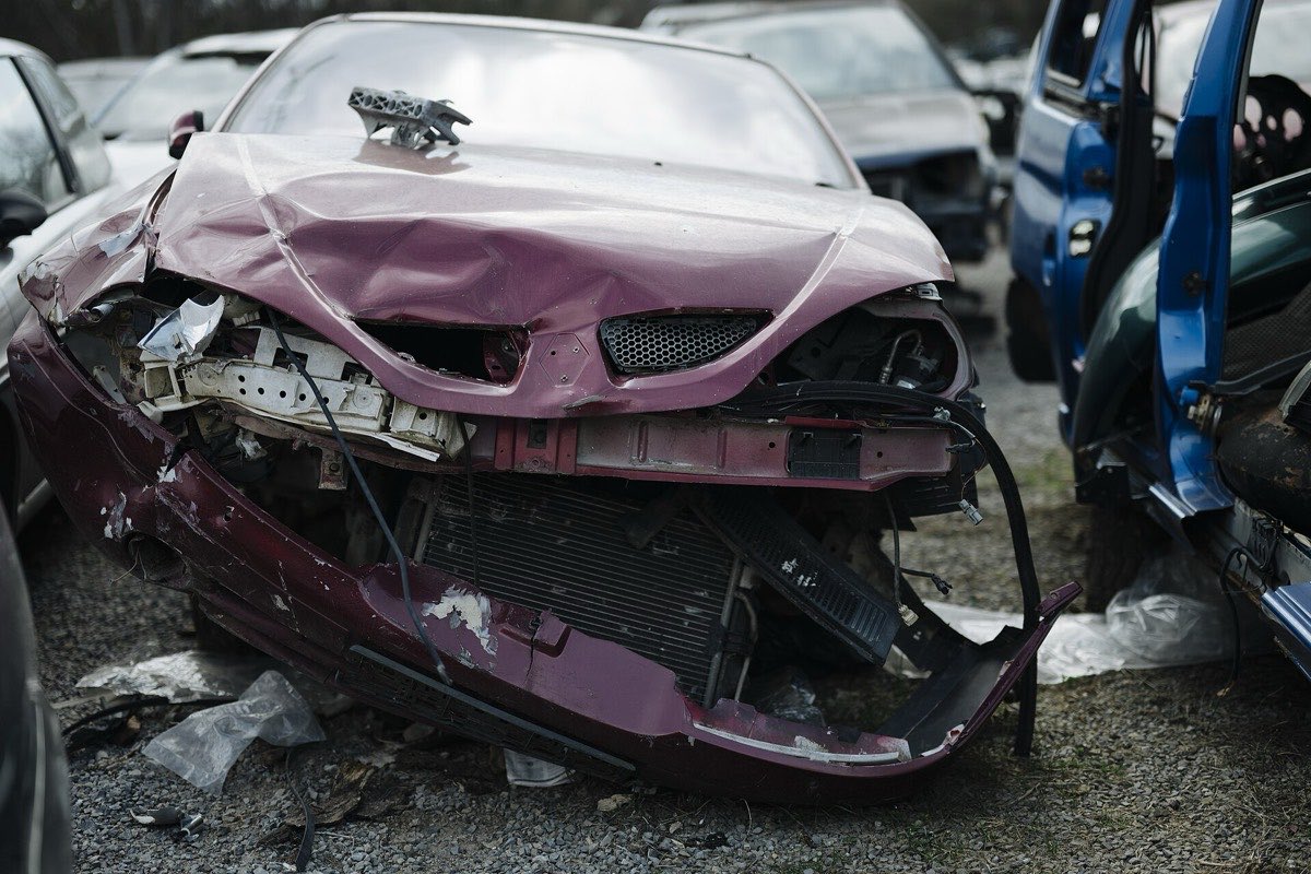 End-of-life vehicle in a scrap yard awaiting processing